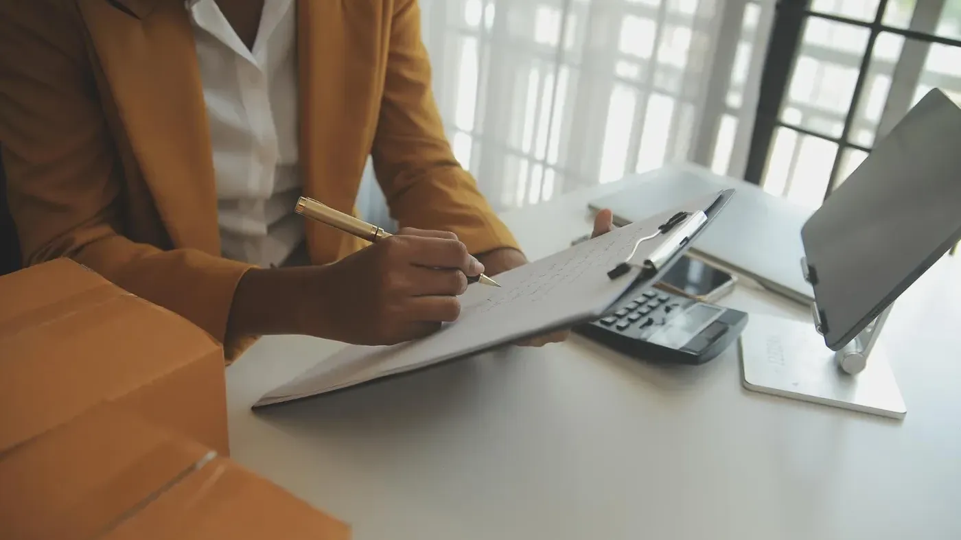 person writing down notes